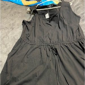 CCX XXL 22/24 Black Dress with tie waist, pockets, and a  rounded bottom.